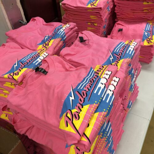 A stack of colorful shirts with printed designs